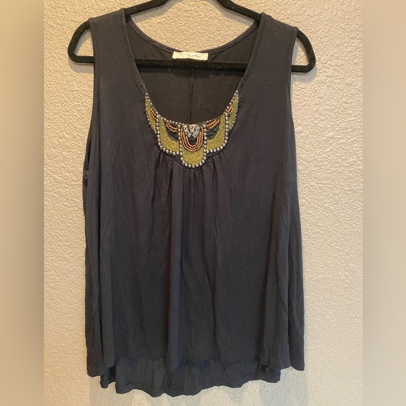 Women’s black short sleeve top with Beaded embellishment on neck line. - Picture 1 of 2